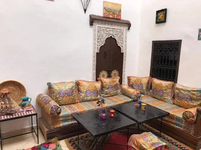 a living room with a couch and a table at Hostel Kech Vibe in Marrakech