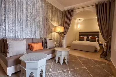 a living room with a couch and a bed at Ryad Selyen in Marrakech