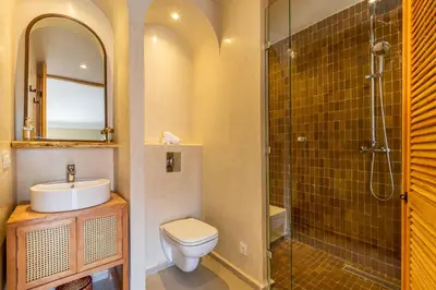 a bathroom with a toilet and a sink and a shower at L'Atelier N°12, Loft, Terrasse in Marrakech