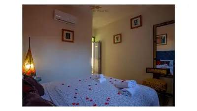 a bedroom with a bed with two stuffed animals on it at Winarouze house in Marrakech