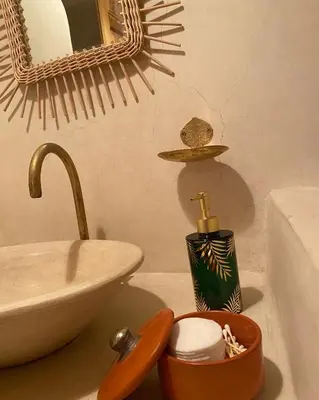 a bathroom with a sink and a counter top with a sink at Riad21 in Marrakech