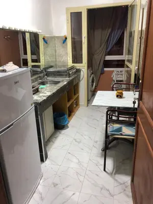 a kitchen with a sink and a counter at Appartement cosy et discret in Marrakech