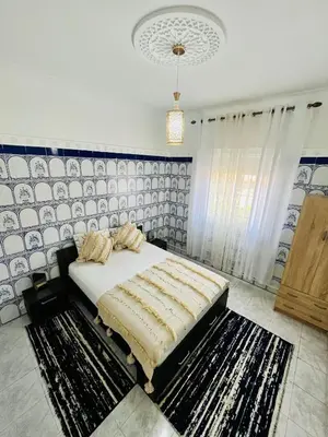 a bedroom with a large bed in a room at Mamounia Patio & Rooftop in Marrakech
