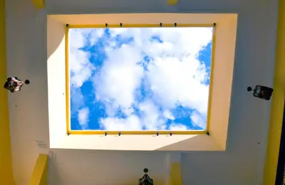a window with a picture of a blue sky at Riad Dar La Rose in Marrakech