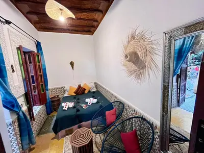 a dining room with a table and chairs at RIAD TENDANCE IN MARRAKECH in Marrakech