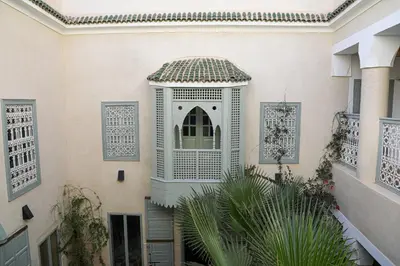 an external view of a building with a window at Riad Amour in Marrakech