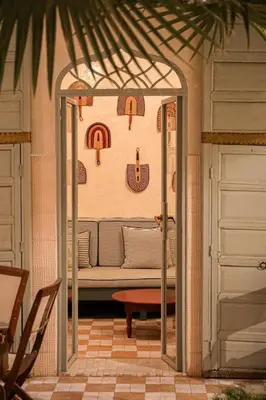 a living room with a couch in a room at Riad Amour in Marrakech