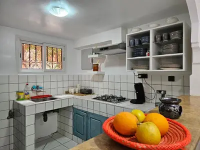 a kitchen with a bowl of fruit on a counter at Duplex el Madina in Marrakech