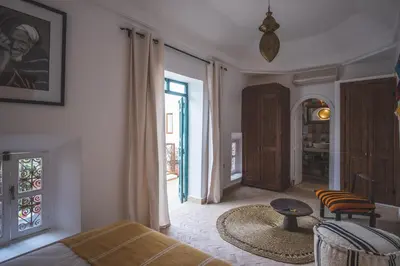 a living room with a couch and a table at Riad Villa Berna under Swiss Management in Marrakech