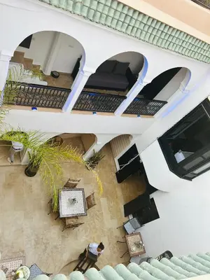 an overhead view of a building with tables and chairs at Riad RIM in Marrakech