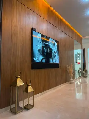 a flat screen tv on a wall in a lobby at Oasi Marrakech in Marrakech