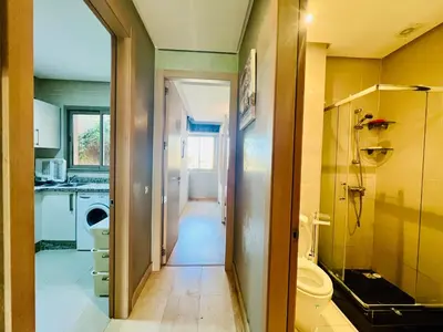 a bathroom with a toilet and a sink and a shower at Corail Apart Golfique -Prestigia in Marrakech