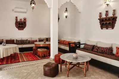 a living room with a couch and a table at Riad Al Wifak in Marrakech