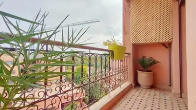 a balcony with plants and a fence at Résidence Anas Majorelle -Centre Ville in Marrakech