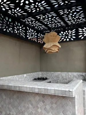 a large room with a fountain and a light fixture at RIAD JOUJ- Oasis privée avec bassin et SPA - kasbah in Marrakech