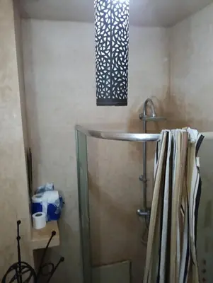 a bathroom with a sink and a shower at Au centre,Charmant appartement dans un quartier chic et calme, Très bon emplacement in Marrakech