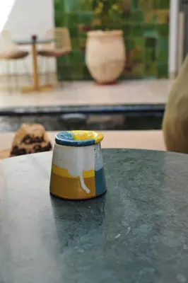 a coffee cup sitting on top of a table at RIAD DAR BAYANE in Marrakech