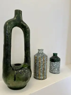 three vases sitting on a shelf next to each other at RIAD DAR BAYANE in Marrakech