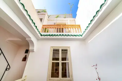 a white house with a window and a roof at Riad Kasbabouch - Breakfast - 10mn to Jamaa Al Fna in Marrakech
