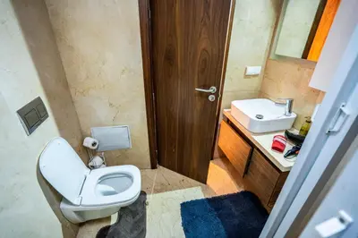 a bathroom with a toilet and a sink at Apartment pool marrakech in Marrakech
