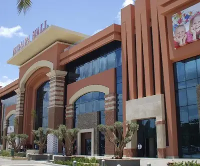a large building with a building with two babies on it at Royal Deluxe Diamond - Marrakech, Luxe Pool View in Marrakech
