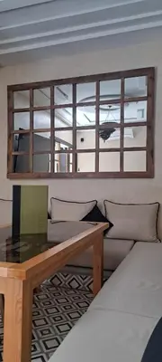 a living room with a couch and a table at Riad Al Nubala in Marrakech