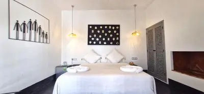a bedroom with a bed with two towels on it at RIAD 48 & SPA in Marrakech