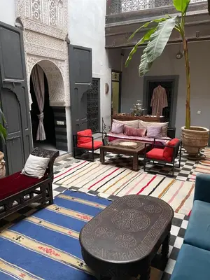 a living room with couches and a table at BKAN RIAD MARRAKECH in Marrakech