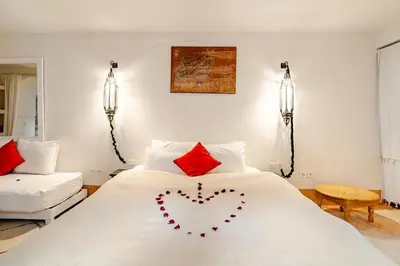 a bedroom with a bed with a heart made out of pillows at Riad Dar Zitouna Marrakesh - entire house in exclusivity in Marrakech
