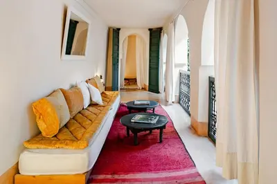 a living room with a couch and a table at Riad Dar Zitouna Marrakesh - entire house in exclusivity in Marrakech