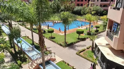 an overhead view of a swimming pool at a resort at un moderne chic appartement vue sur piscine in Marrakech