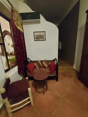 a living room with a couch and a table at Riad dar Karam in Marrakech