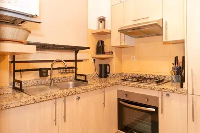 a kitchen with a sink and a counter top at Pavillon Affaoui Golf & Waky in Marrakech