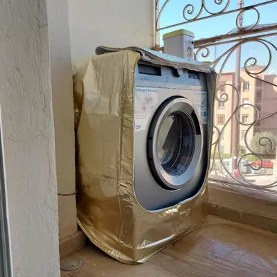 a washing machine wrapped in plastic sitting next to a window at Appartement pour Familles en Résidence-Piscine et WiFi Fibre Optique in Marrakech