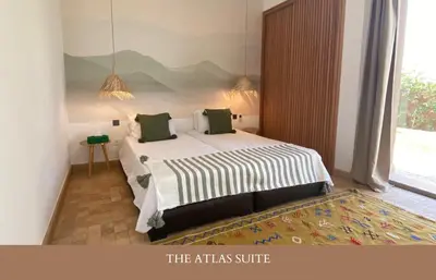 a bedroom with a large bed in a room at Villa Zen'O Palmeraie - Hot Pool in Marrakech