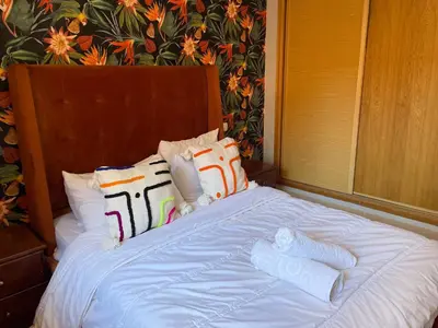 a bed with two pairs of white socks on it at Sunset Marrakech in Marrakech