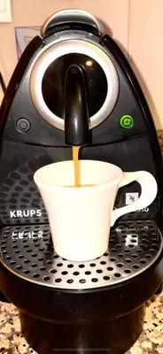 a coffee maker pouring coffee into a cup at Sunset Marrakech in Marrakech