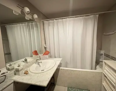 a bathroom with a sink and a shower and a tub at Sunset Marrakech in Marrakech
