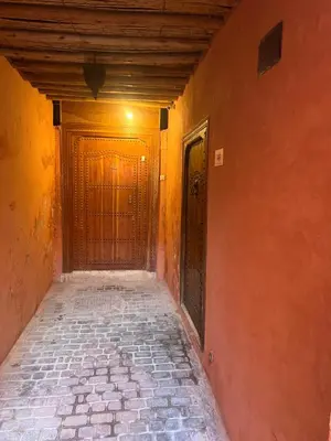 an empty hallway with two doors in a building at Riad Dar Les Freres in Marrakech