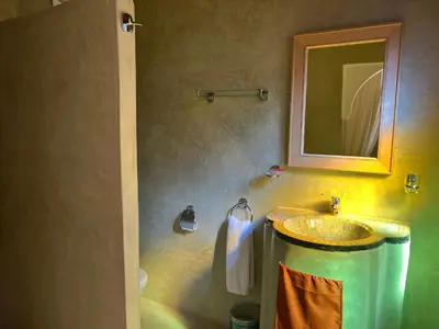 a bathroom with a sink and a mirror at Riad Dar Les Freres in Marrakech