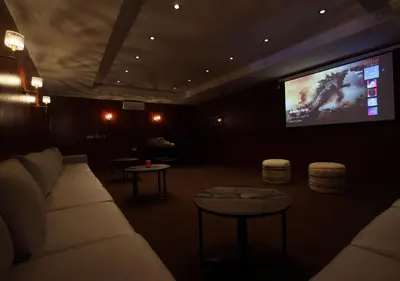 a living room with a couch and a flat screen tv at Vista de La Palma in Marrakech