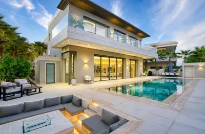 a villa with a swimming pool and a house at Villa Simeon Marrakech in Marrakech