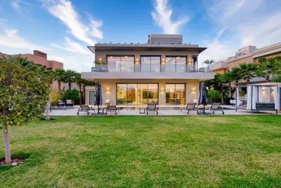 a large house with a lawn in front of it at Villa Simeon Marrakech in Marrakech