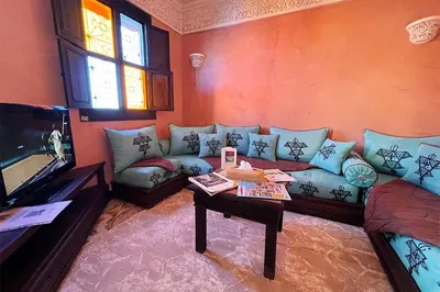 a living room with a couch and a table at Dar Ben Saleh in Marrakech