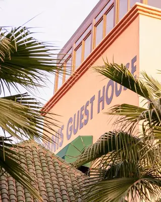 a building with a sign on the side of it at Yanis Guest House in Marrakech
