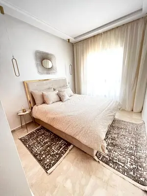 a bedroom with a large bed and a window at Arras operah marrakech in Marrakech
