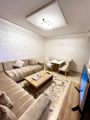 a living room with a couch and a table at Arras operah marrakech in Marrakech