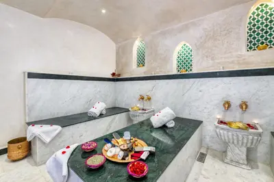 a room with a table with a plate of food at Riad Diamond Of Marrakech & Spa in Marrakech