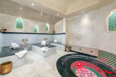 a bathroom with a bath tub and a red pool at Riad Diamond Of Marrakech & Spa in Marrakech