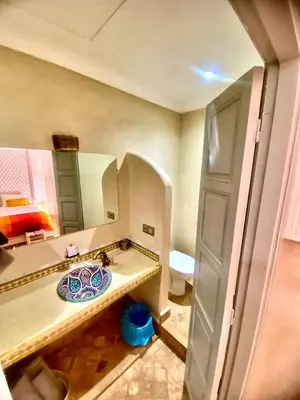 a bathroom with a sink and a toilet at Riad privatisé Magnolia in Marrakech